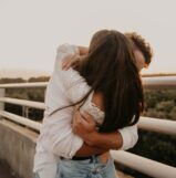 a man and woman kissing