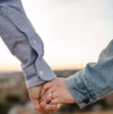two person holding hands